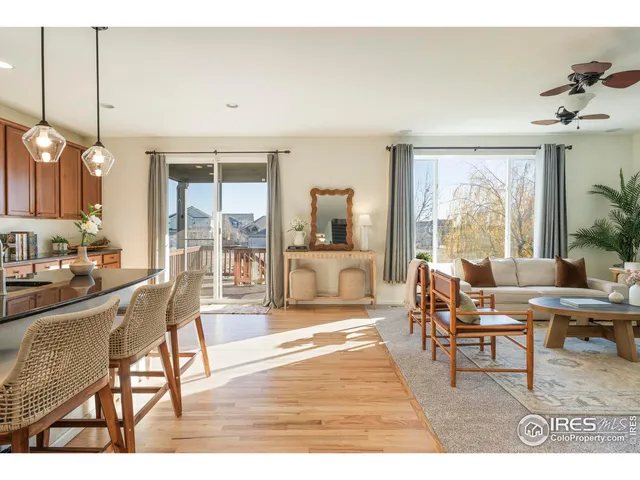 a kitchen with stainless steel appliances kitchen island granite countertop a stove a sink and a refrigerator