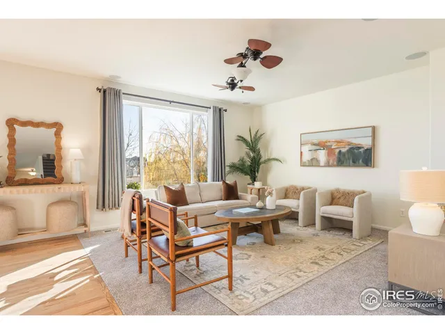 a living room with a couch and a dining table