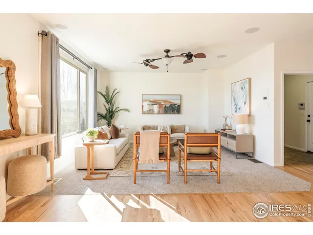 a dining room with furniture and a window