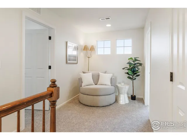 a bedroom with furniture and windows
