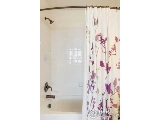 a living room with a table and a rug