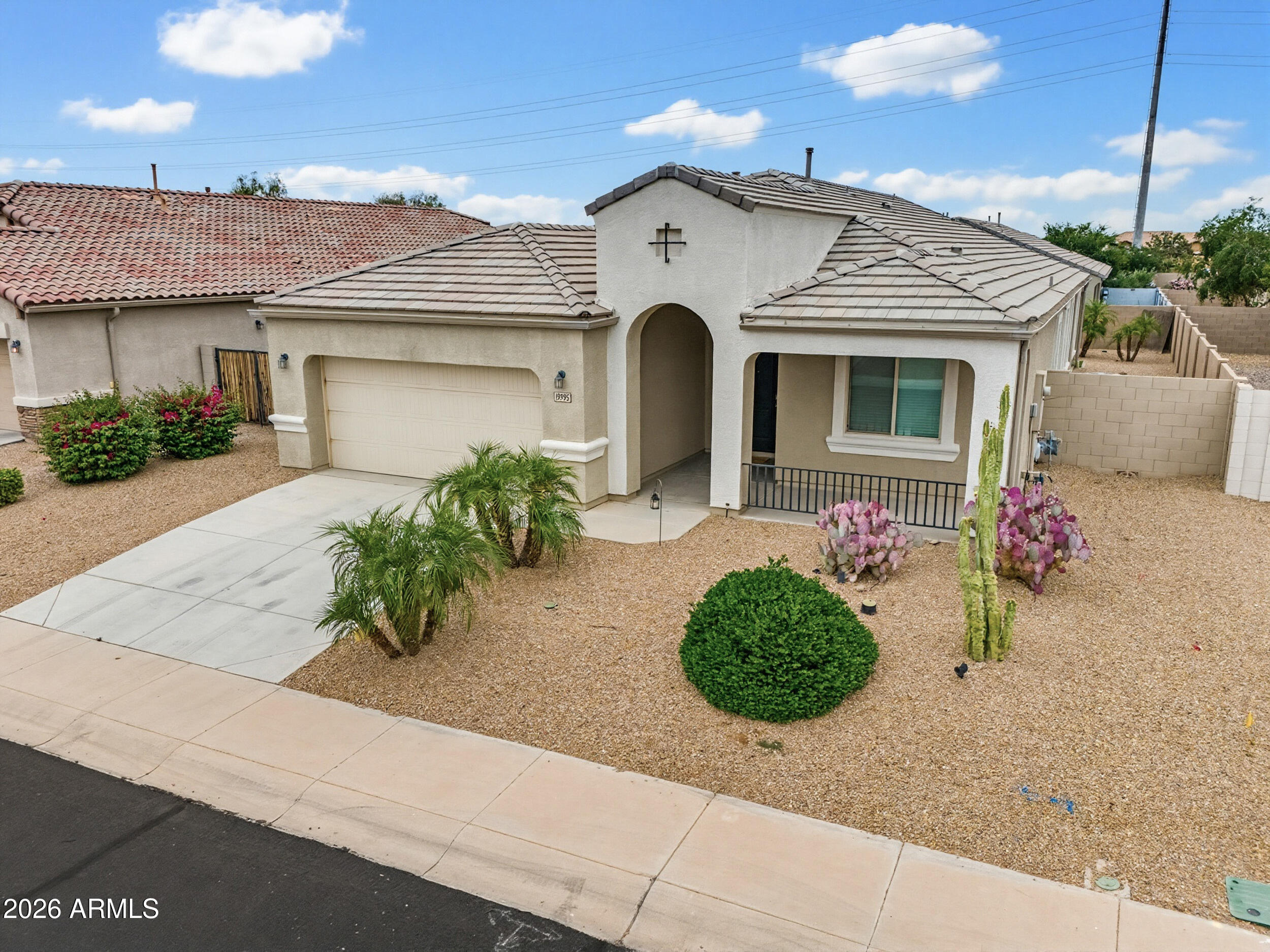 19995 North Ben Court Maricopa, AZ 85138 - Photo 7 of 51 a front view of a house with a yard and garage