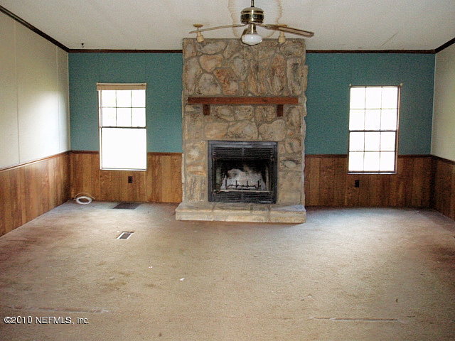 45193 Bismark Road Callahan, FL 32011 - Photo 4 of 11 a view of empty room with a fireplace