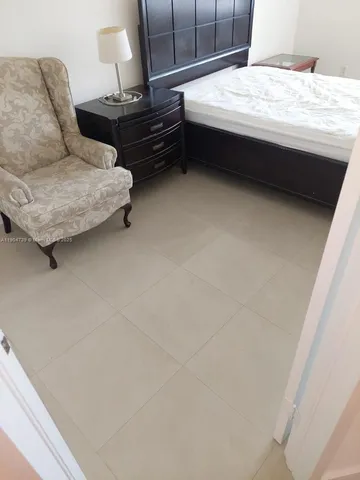 a living room with couches and a couch