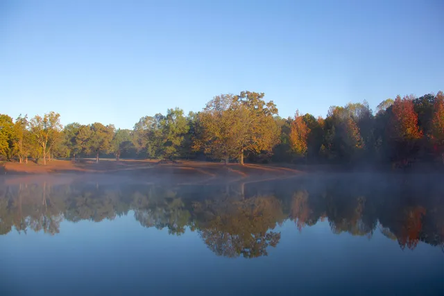 a view of lake with green space