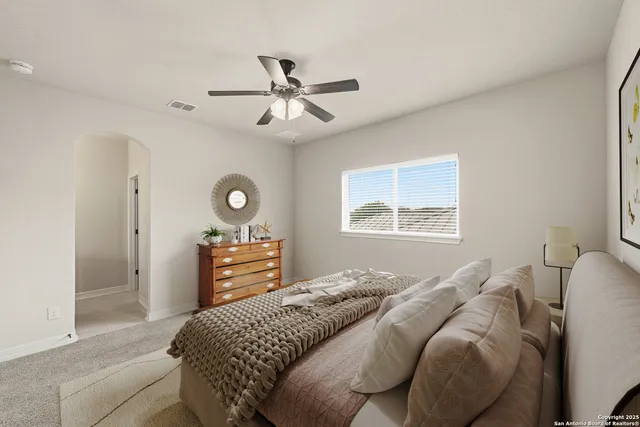 a view of a hallway with wooden floor and entryway