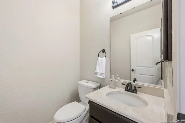 a view of kitchen with cabinets and wooden floor