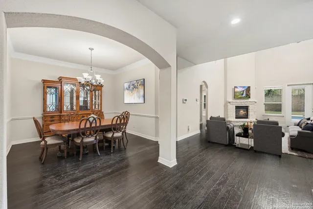 a kitchen with kitchen island a white cabinets and stove