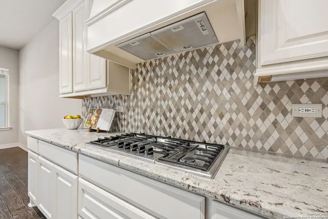 a bathroom with a double vanity sink and a bathtub