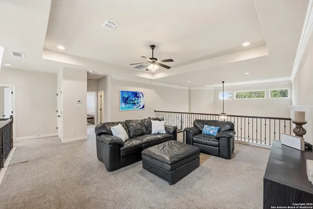 a bathroom with a granite countertop sink a toilet a mirror and shower