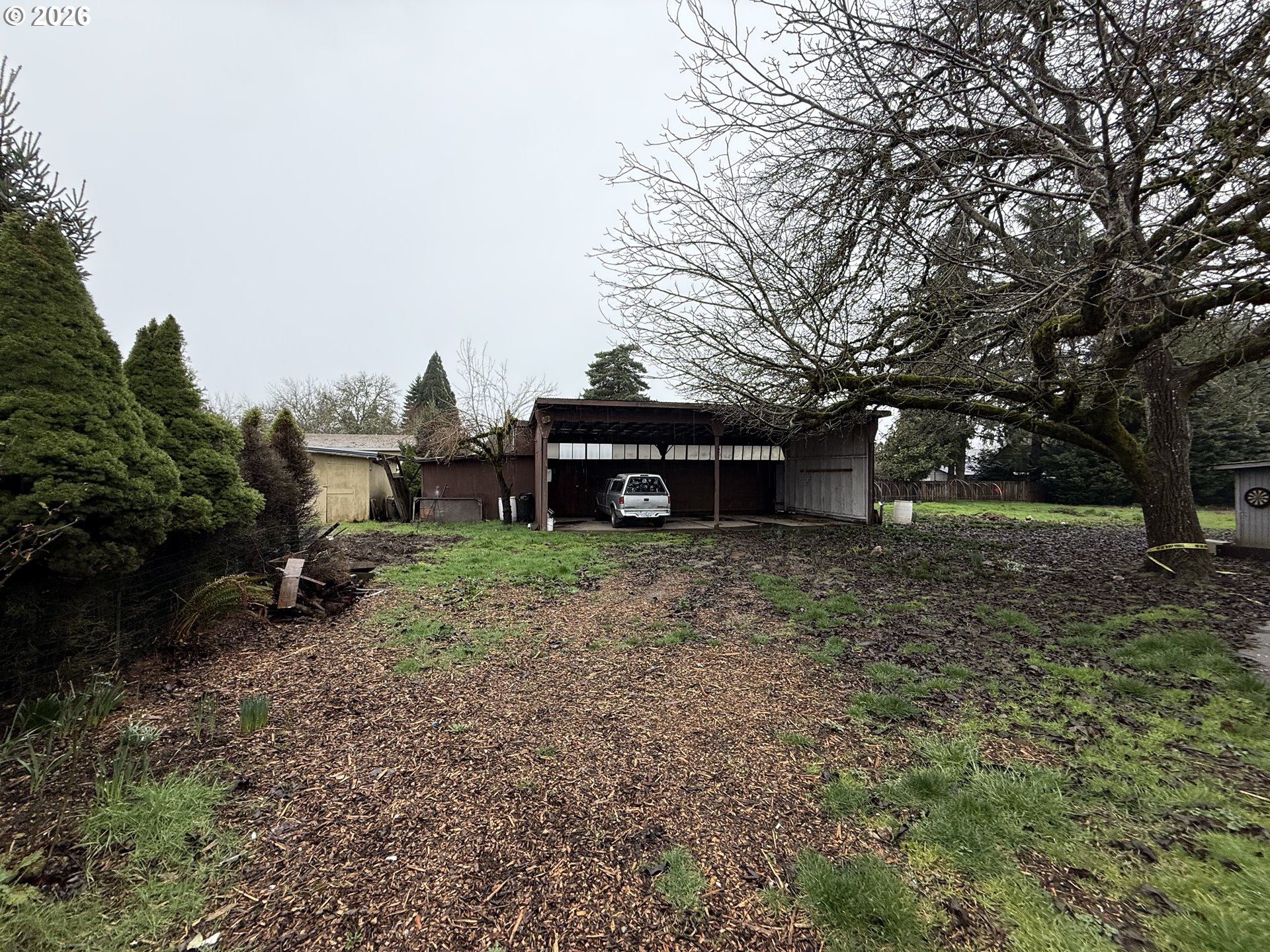 3945 Southwest 185th Avenue Beaverton, OR 97078 - Photo 22 of 26 a view of a house with a yard and hanging chair