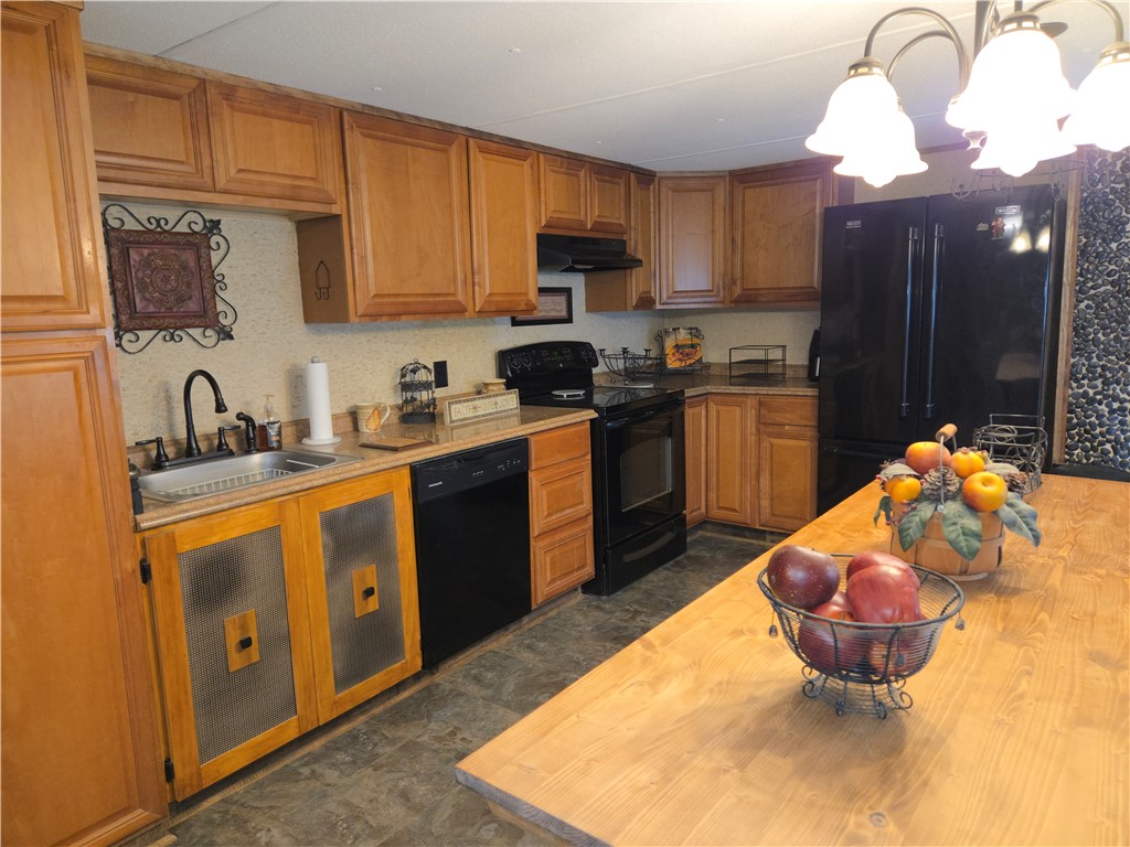 238 Forest Lane Starr, SC 29684 - Photo 3 of 11 A warm kitchen with ample cabinetry offers a welcoming space for culinary creations.
