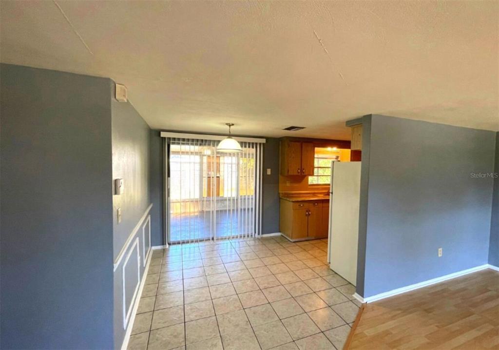 7335 Ashwood Drive Port Richey, FL 34668 - Photo 3 of 12 a view of a kitchen with a sink and an empty room
