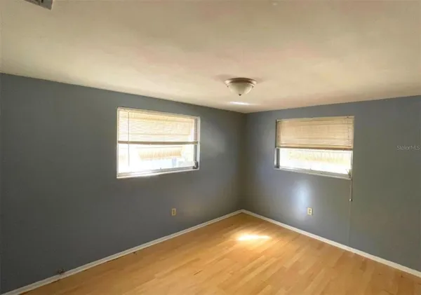an empty room with a empty space and window