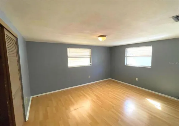 a view of an empty room with a window