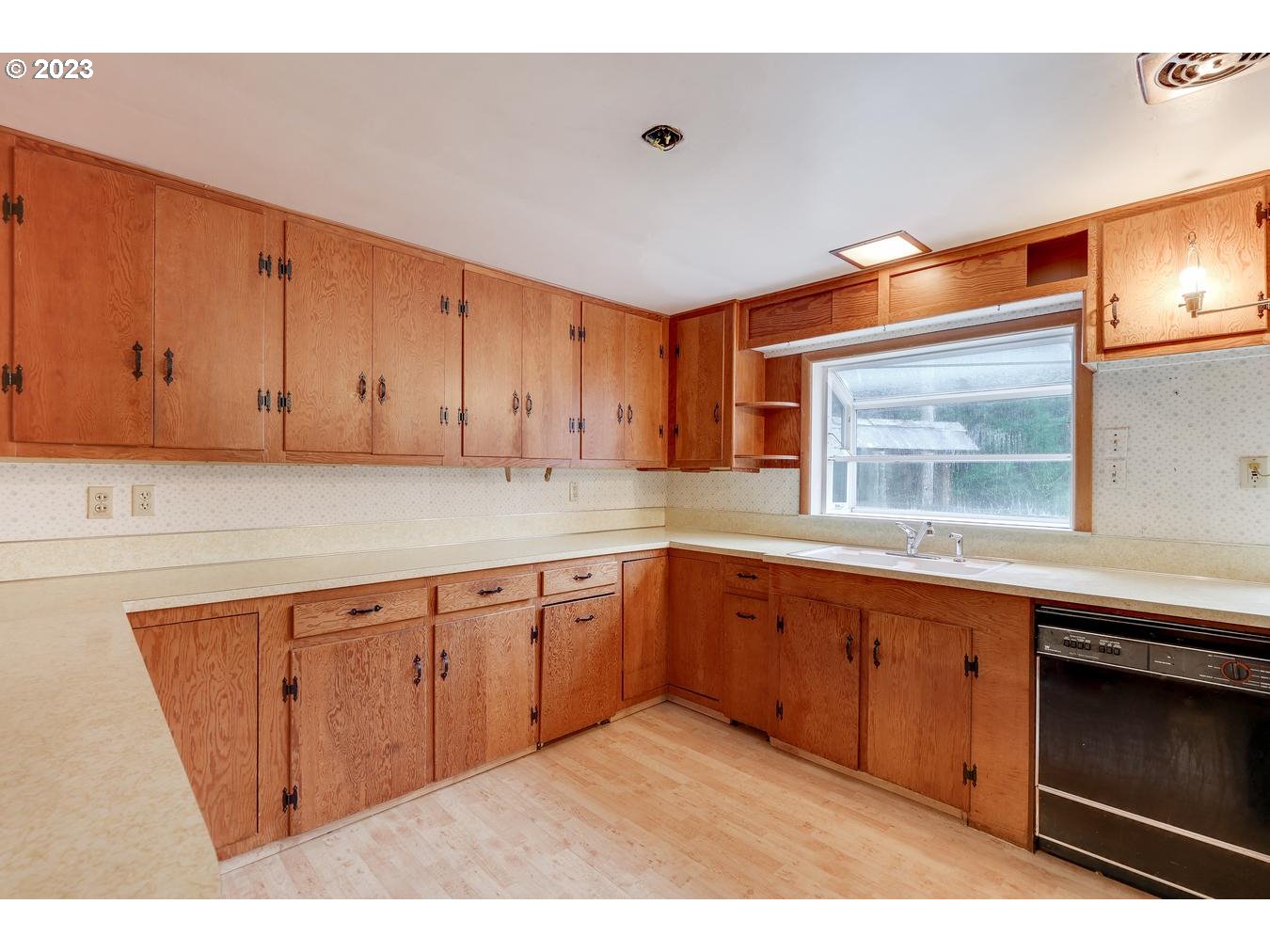 39161 Southeast Rude Road, Unit B Sandy, OR 97055 - Photo 15 of 32 a kitchen with granite countertop white cabinets and stainless steel appliances
