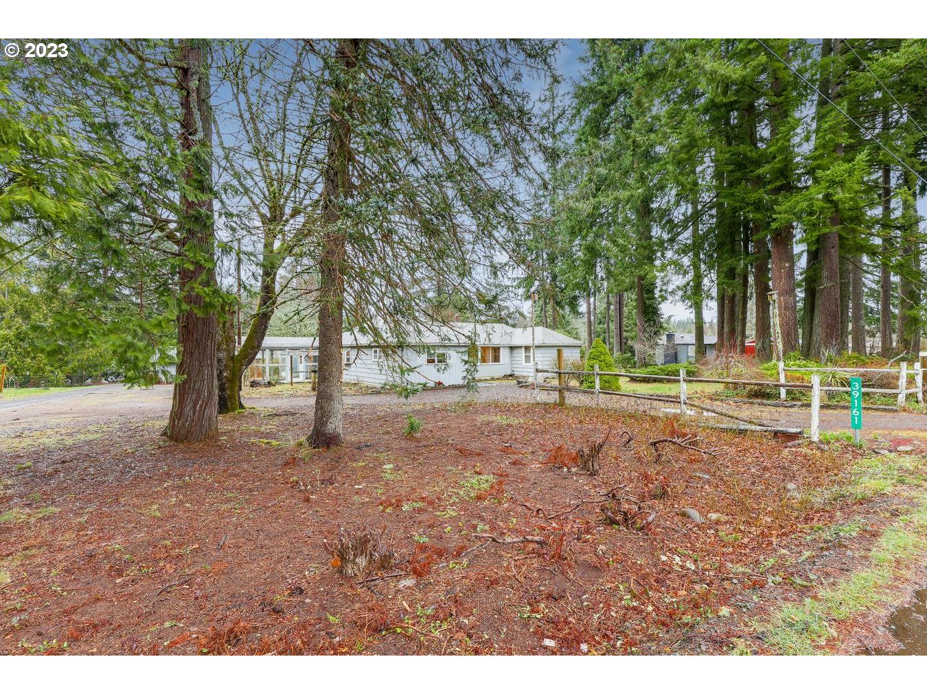 39161 Southeast Rude Road, Unit B Sandy, OR 97055 - Photo 2 of 32 a view of a tree in the middle of a yard