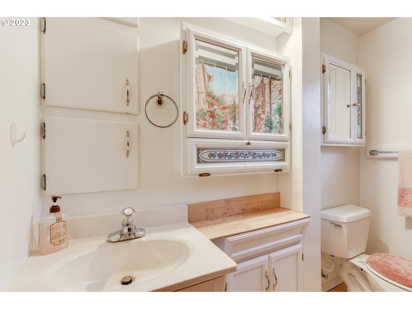 39161 Southeast Rude Road, Unit B Sandy, OR 97055 - Photo 25 of 32 a bathroom with a sink a toilet and a mirror