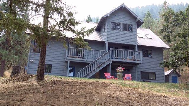 8707 Yank Gulch Road Talent, OR 97540 - Photo 19 of 19 a view of a house with a yard and large tree