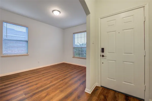 a kitchen with stainless steel appliances granite countertop a stove top oven a sink and a microwave