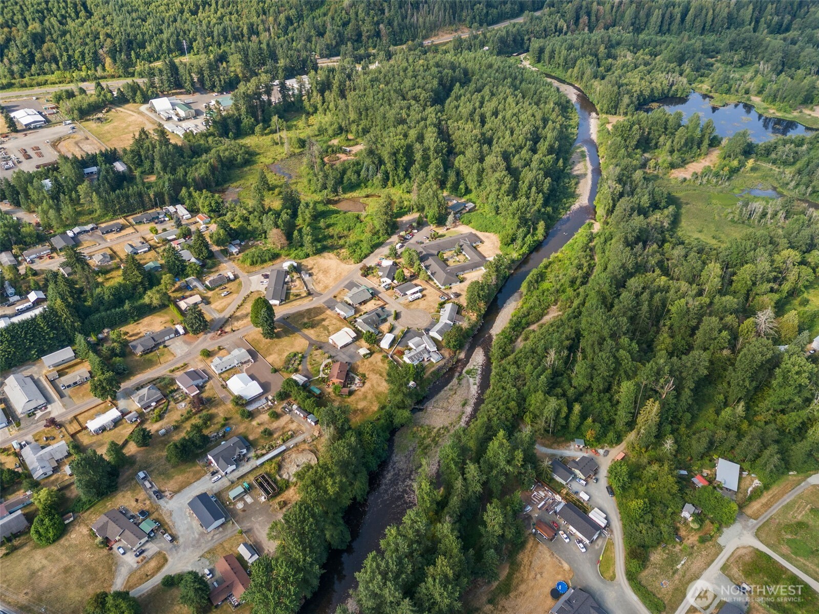 841 West Main Morton, WA 98356 - Photo 13 of 27 an aerial view of a residential houses with outdoor space and trees