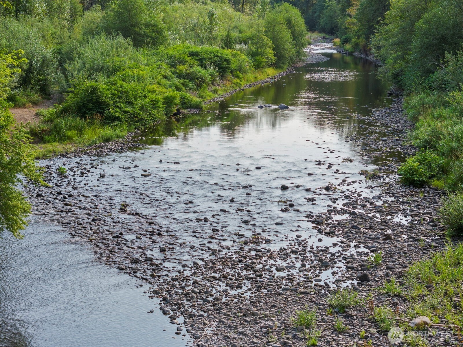 841 West Main Morton, WA 98356 - Photo 2 of 27 a view of a lake with a yard