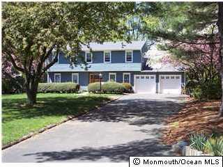 32 Rivers Edge Drive Little Silver, NJ 07739 - Photo 1 of 3 a view of a yard in front of a house with large tree