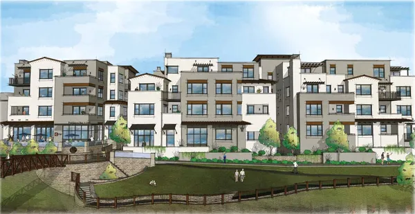 a front view of a residential apartment building with a yard
