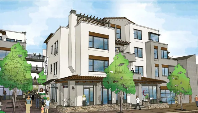 a front view of a building with a garden