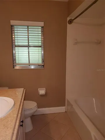 a bathroom with a toilet a sink and a bathtub