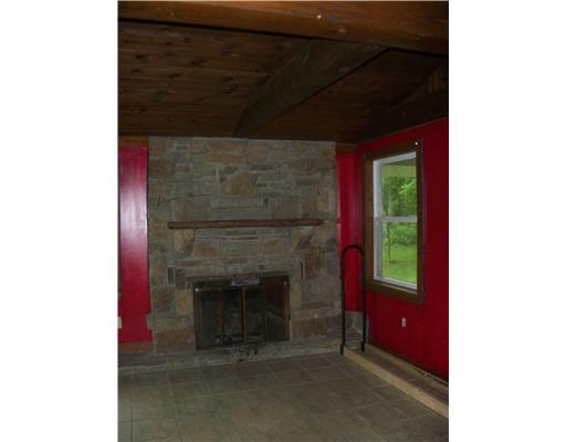 325 Freeman Falls Road Acme, PA 15610 - Photo 12 of 18 Family Room. Relax around the fireplace at your country estate.