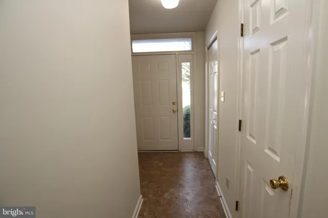 a view of a bathroom from a hallway