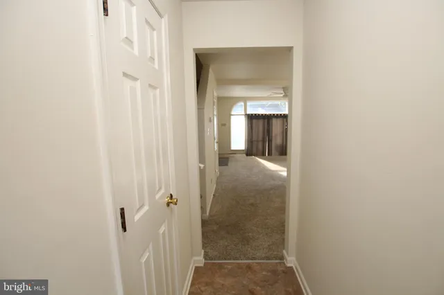 a view of a bathroom from a hallway