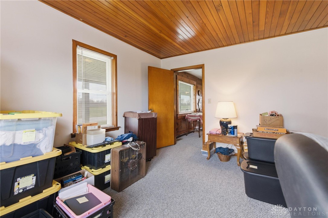 11379 Friend Road Germantown, OH 45327 - Photo 16 of 44 This versatile room features warm wood paneling, offering a cozy and adaptable living space.
