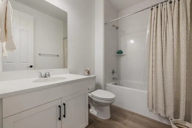 a bedroom with bed and a window