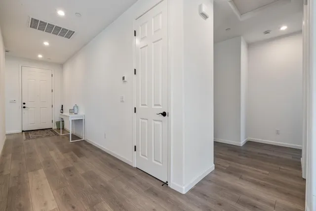 a living room with a washer and dryer