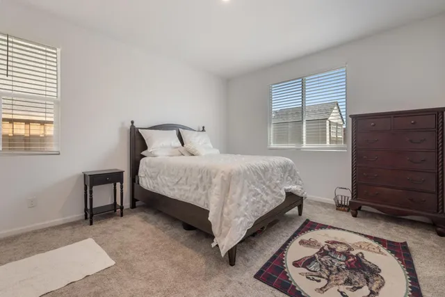 a bedroom with a bed and a closet