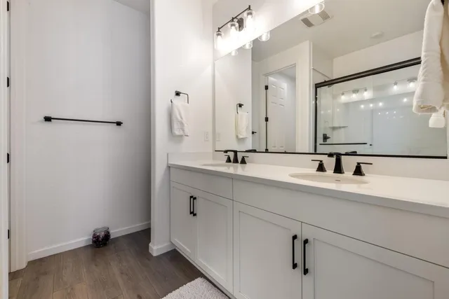 a bathroom with a bathtub and a glass door