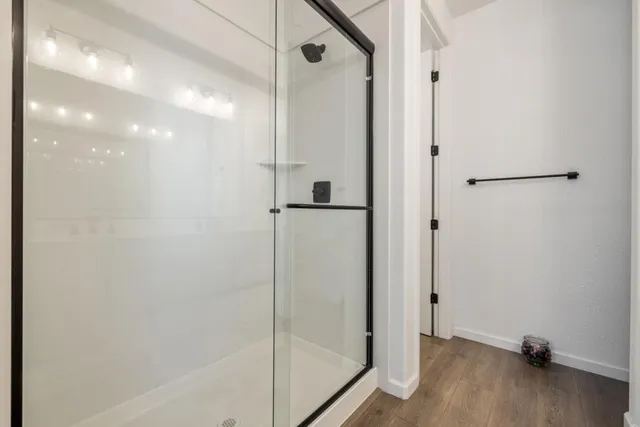 a view of a house with wooden floor and a fence