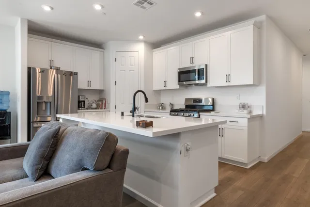 wooden floor with white walls
