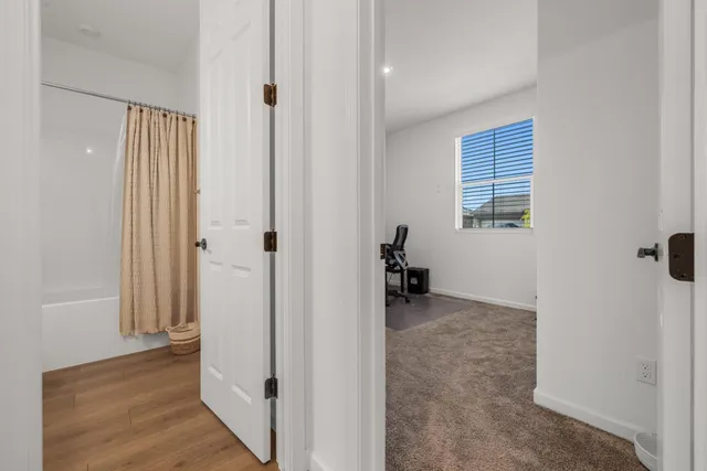 a view of a workspace with furniture and a workspace