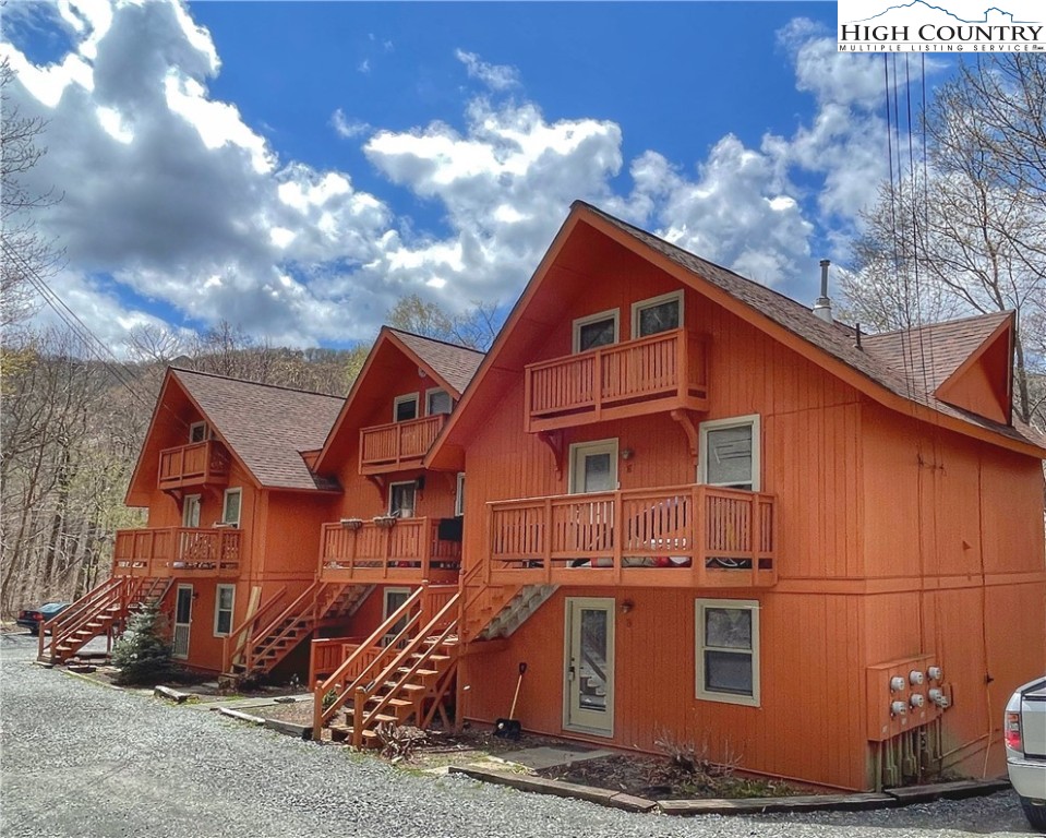102 Skiview Lane, Unit A3 Beech Mountain, NC 28604 - Photo 1 of 20 a view of a house with a yard