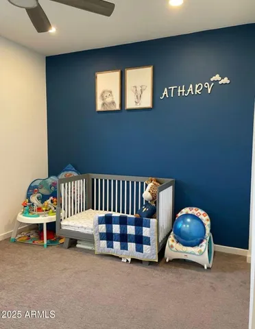 a room with two chair and a window