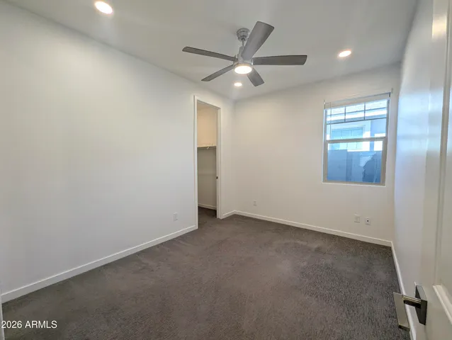 a kitchen with granite countertop a refrigerator and a sink