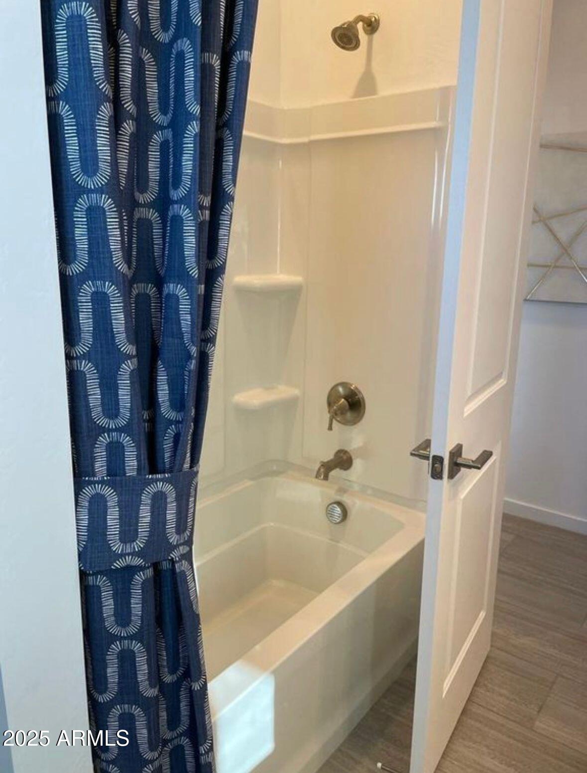 22547 East Quintero Road Queen Creek, AZ 85142 - Photo 13 of 17 a bathroom with a bathtub and shower