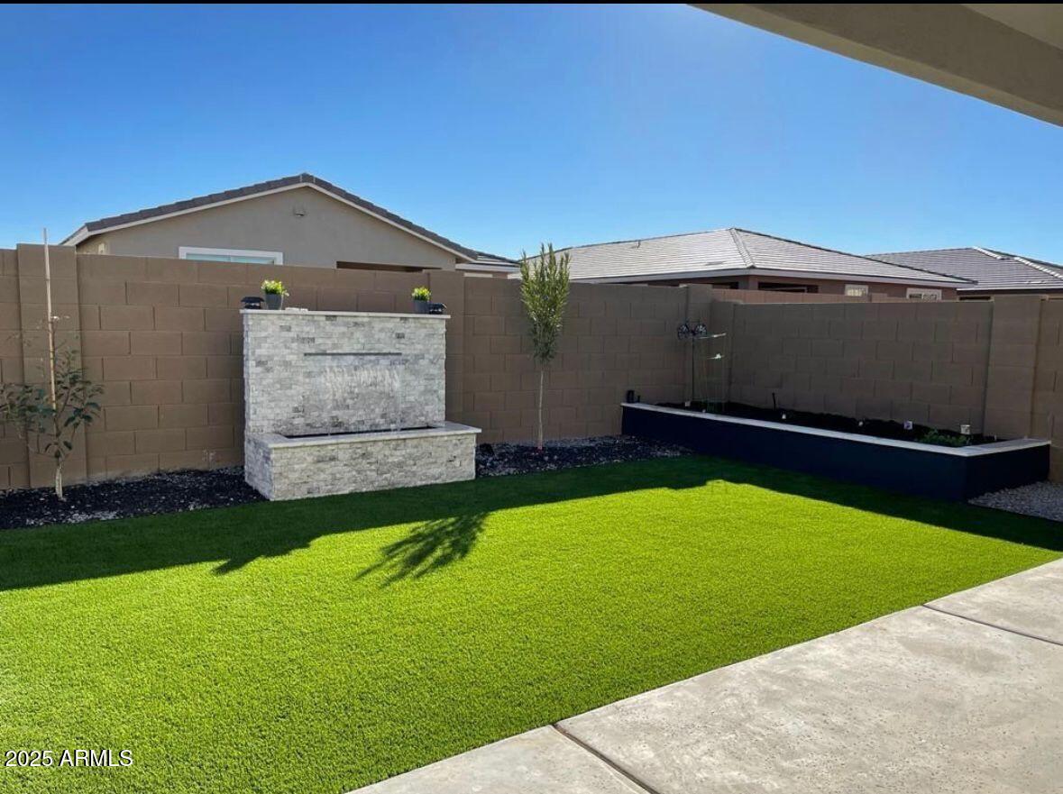 22547 East Quintero Road Queen Creek, AZ 85142 - Photo 14 of 17 a backyard of a house with lots of green space