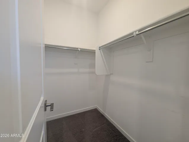 a view of an empty room with glass door