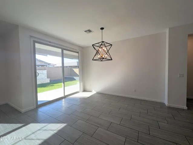 a bathroom with a double vanity sink mirror and shower