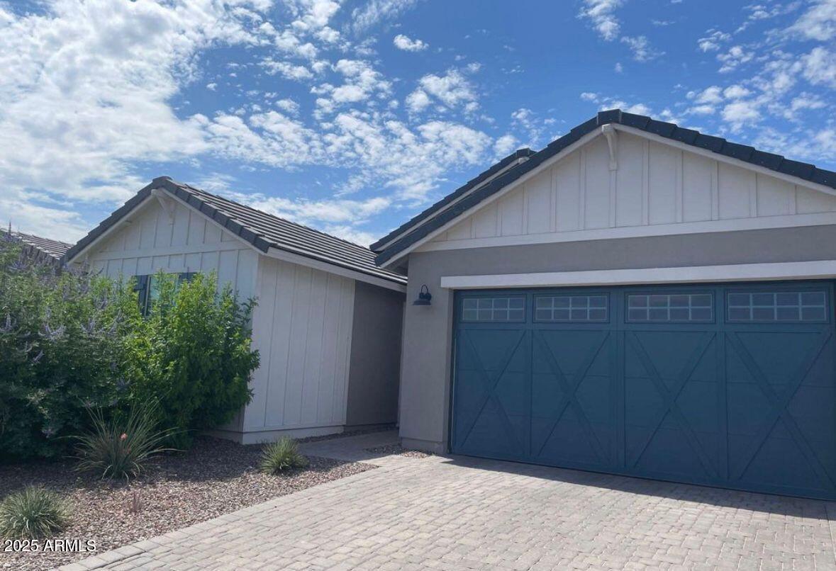 22547 East Quintero Road Queen Creek, AZ 85142 - Photo 2 of 17 a house with a tree in front of it