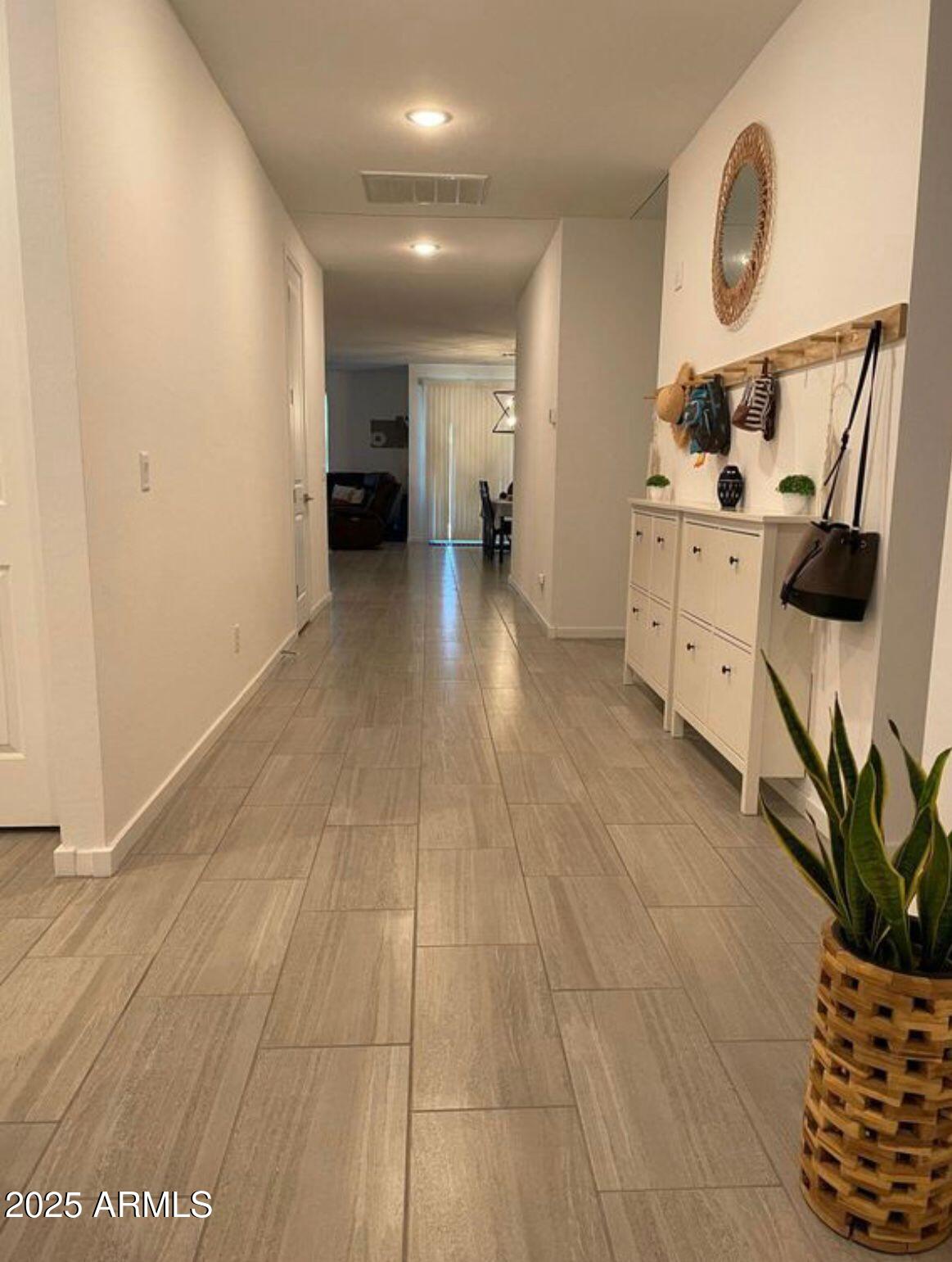 22547 East Quintero Road Queen Creek, AZ 85142 - Photo 4 of 17 a view of a hallway to room with wooden floor